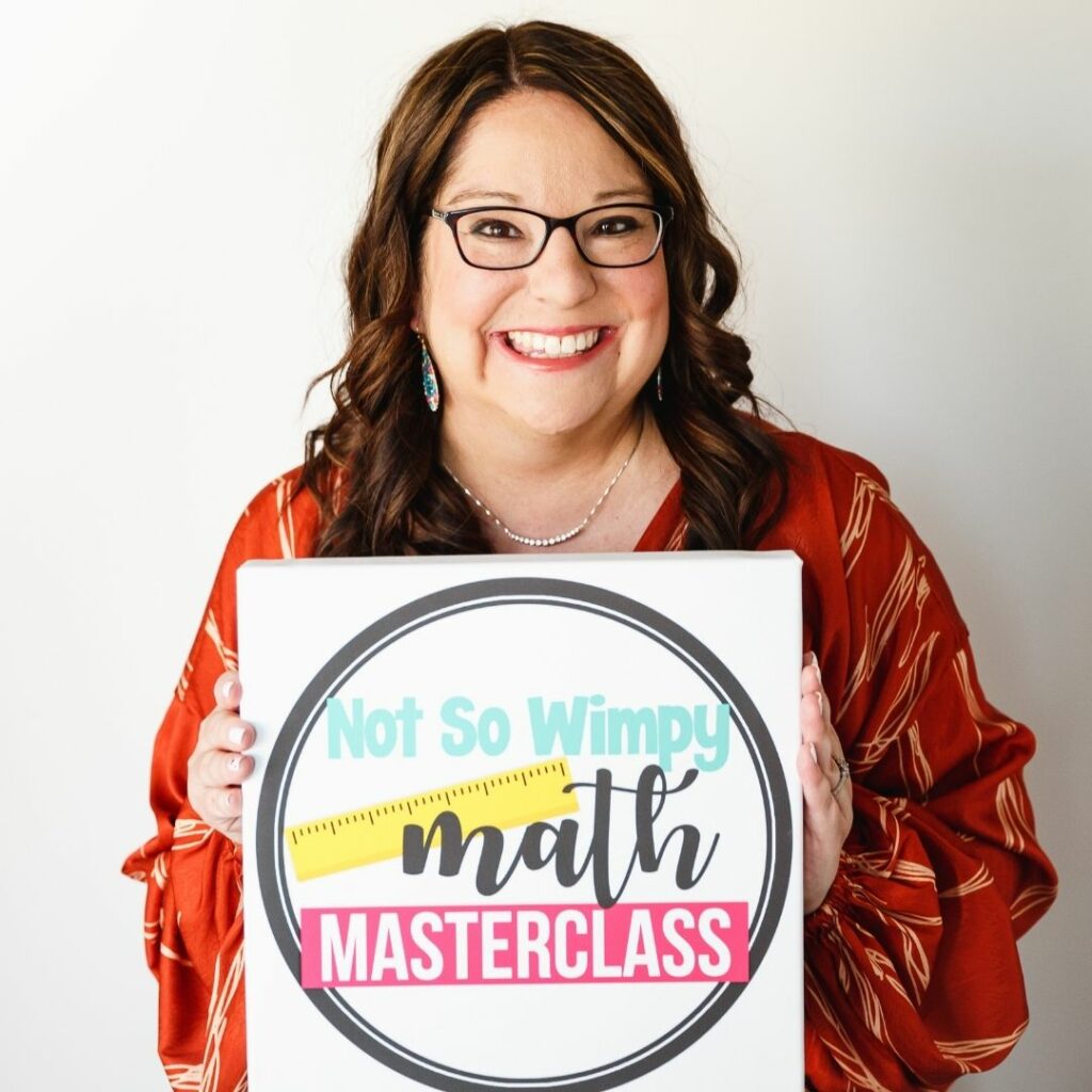 Jamie holding Math Masterclass sign