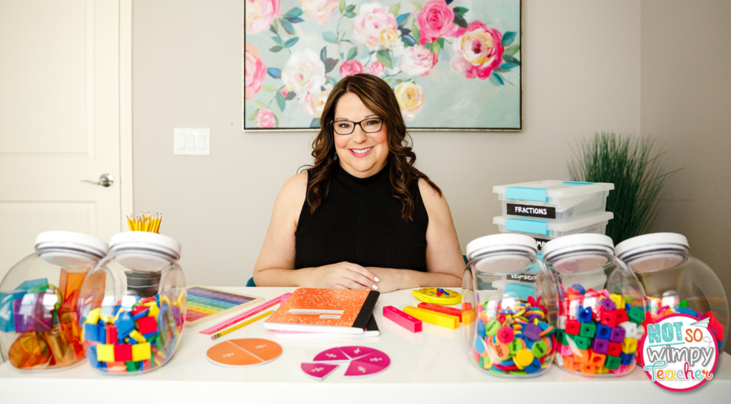 Image of Jamie surrounded by math manipulatives.